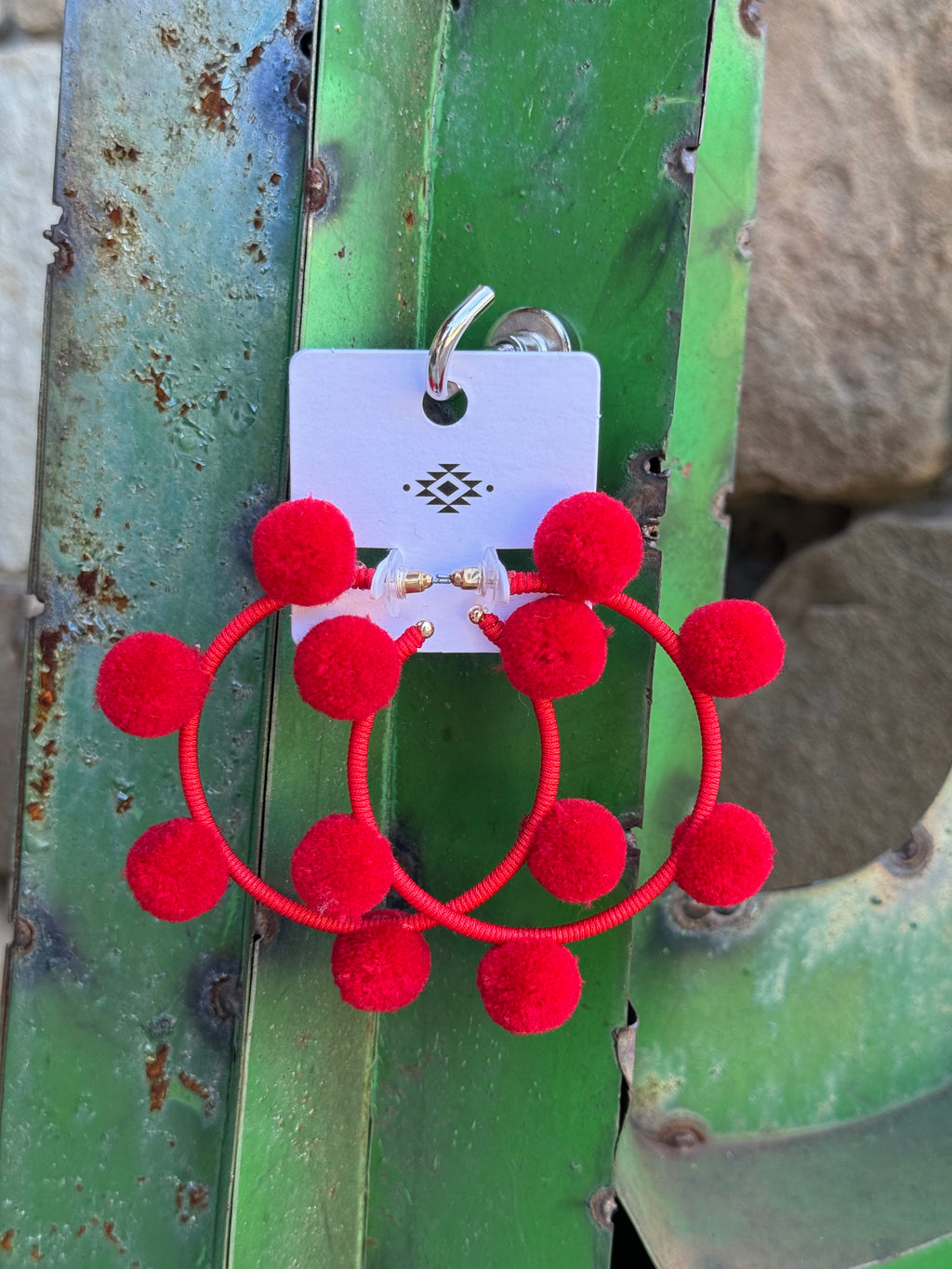 Red pompom earrings